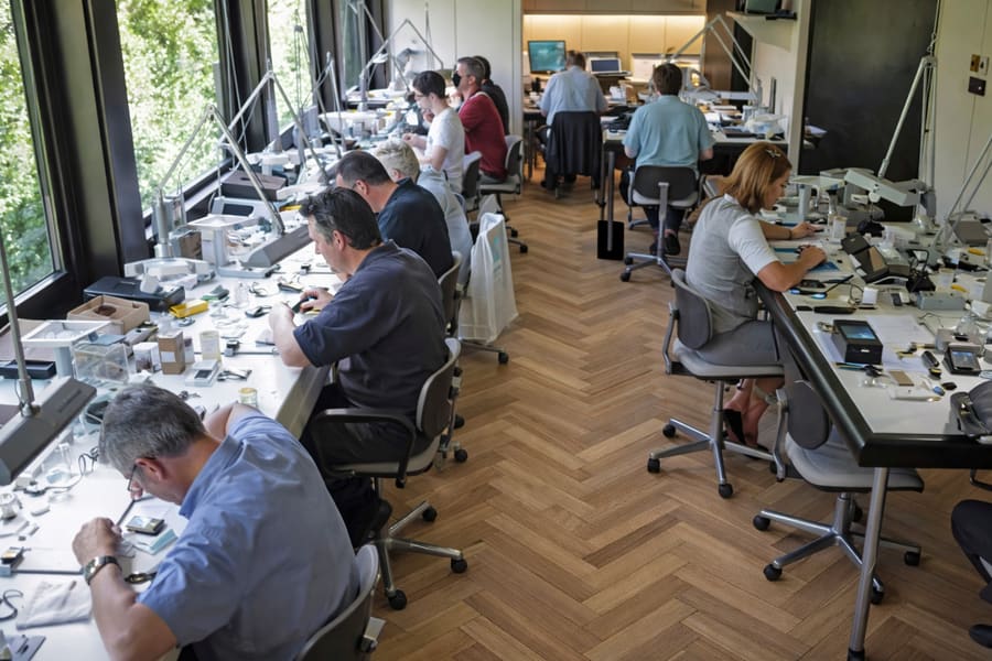 Luc Vets examining diamonds in the Antwerp workshop — over 50 years of Belgian diamond craftsmanship