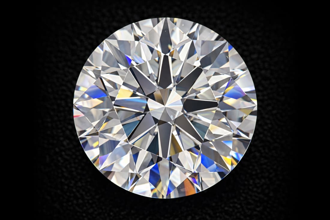 Hearts and arrows pattern visible in a medium-sized pointer diamond